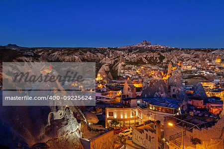 Cylindrical stone cliffs and cave houses in Goreme, Turkey