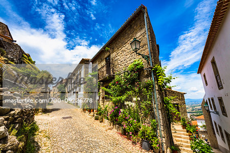 Traditional stone houses and cobblestone street in the village of Monsanto, Idanha-a-Nova, Portugal