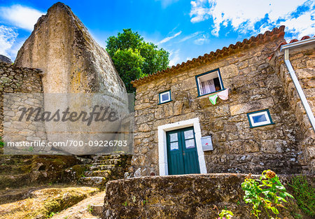 Traditional stone house built around large boulder in the village of Monsanto, Idanha-a-Nova, Portugal