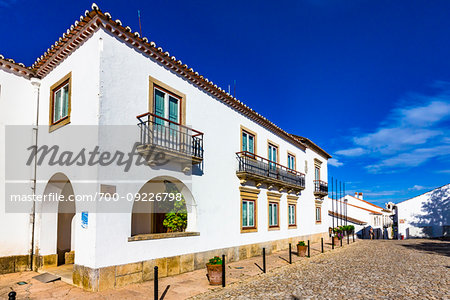 White washed stucco houses on the cobblestone street in the municipality of Marvao in the Portalegre District in Portugal