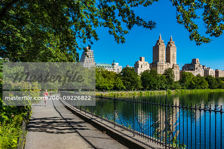 Walkway along the Central Park Reservoir with the San Remo Apartments in the background, New York City, New York, USA