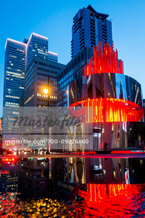 Olympic Torch Sculpture in front of the Canadian Olympic House in downtown Montreal at night, Quebec, Canada