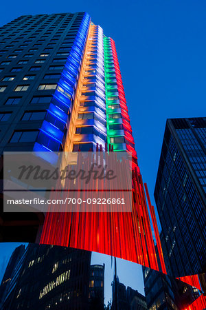 Olympic Torch Sculpture in front of the Canadian Olympic House in downtown Montreal at night, Quebec, Canada