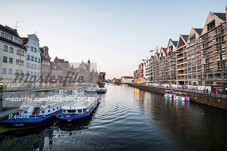 Hanseatic League houses on the Motlawa River at sunset in the pedestrian zone of Gdansk, Poland, Europe