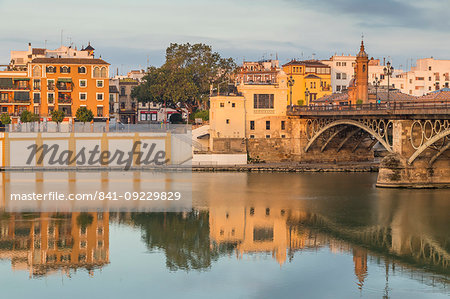 The Triana Neighbourhood seen from the banks of Guadalquivir River at first sunlight, Seville, Andalusia, Spain, Europe