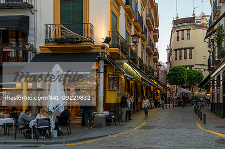 Narrow street in the historical centre at dusk, Seville, Andalusia, Spain, Europe