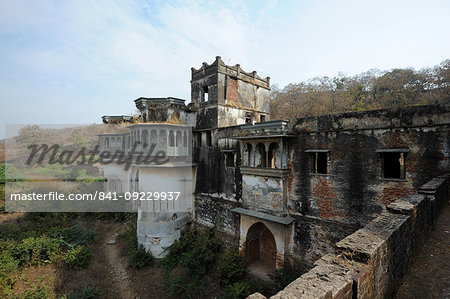 Ruins of the largely derelict but beautiful ornate 19th century royal Raj Mahal, high in the hills of Santrampur, Gujarat, India, Asia