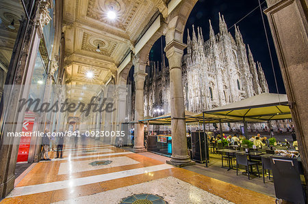 View of Duomo di Milano illuminated at dusk from Galleria Vittorio Emanuele II in Piazza Del Duomo at dusk, Milan, Lombardy, Italy, Europe