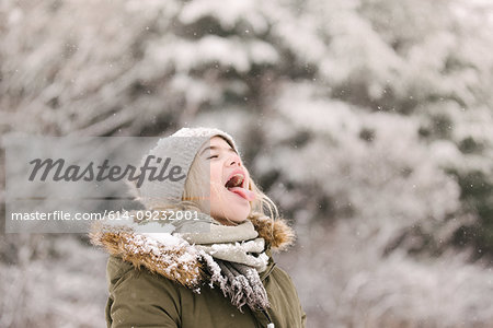 Girl with mouth open waiting for snow