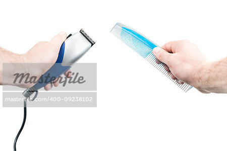 Male hands of a hairdresser hold a clipper and a comb, isolated on a white background, first-person view