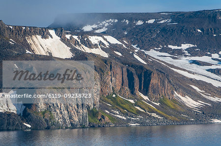 Green cliff in the glacier covered mountains of Franz Josef Land archipelago, Arkhangelsk Oblast, Arctic, Russia, Europe