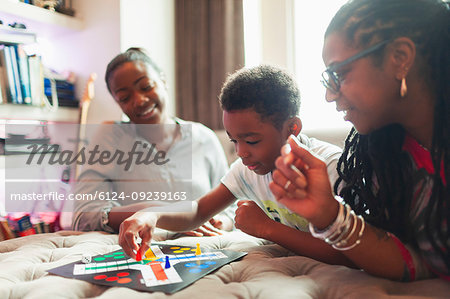 Multi-generation family playing board game