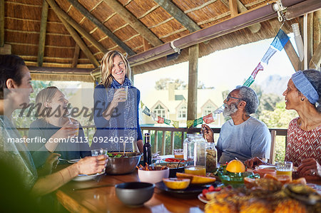 Friends enjoying healthy meal in hut during yoga retreat