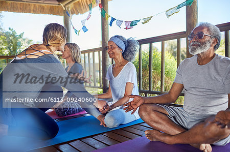 Yoga class meditating in hut during yoga retreat