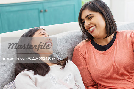 Happy mother and daughter laughing