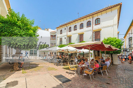 Tourists having lunch in a traditional restaurant of the old town, Cordoba, Andalusia, Spain, Europe