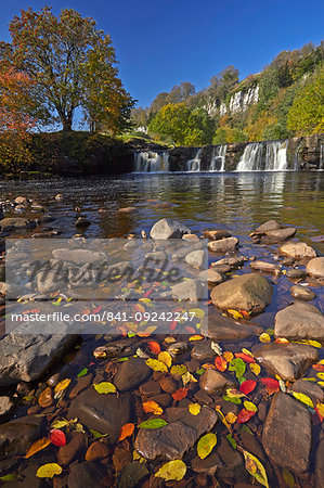 Autumn at Wainwath Falls with Cotterby Scar in the distance, near Keld, Swaledale, Yorkshire Dales, North Yorkshire, England, United Kingdom, Europe