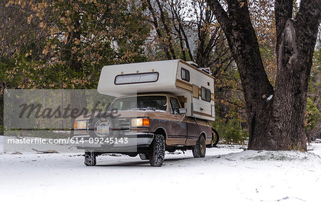 Campervan parked on snow covered ground, Yosemite National Park, California, USA