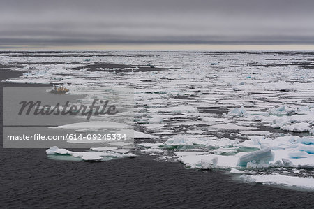 Tourists on inflatable boat exploring Polar Ice cap, 81north of Spitsbergen, Norway