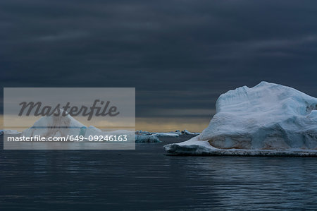 Icebergs under stormy sky, Vibebukta, Austfonna, Nordaustlandet, Svalbard, Norway