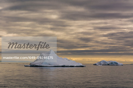 Seascape with icebergs and storm clouds, Vibebukta, Austfonna, Nordaustlandet, Svalbard, Norway