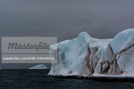 Storm clouds above arctic ocean and ice,  Brasvellbreen, south of Austfonna ice cap, Nordaustlandet, Svalbard, Norway