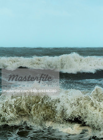 Large waves crashing on dutch shore on stormy day, Rotterdam, Zuid-Holland, Netherlands