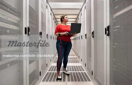 Woman with a damaged hip joint working in data centre