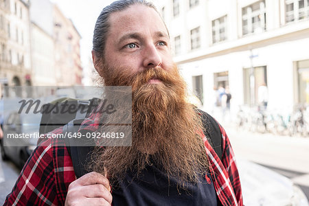 Male traveller hipster on streets, Berlin, Germany