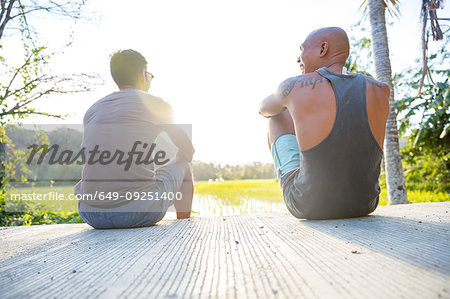 Friends talking on steps, Pagudpud, Ilocos Norte, Philippines