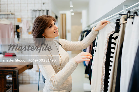 Woman shopping in fashion boutique