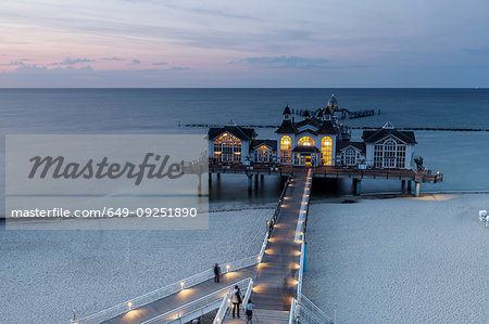 Traditional pier illuminated at sunset, elevated view, Sellin, Rugen, Mecklenburg-Vorpommern, Germany