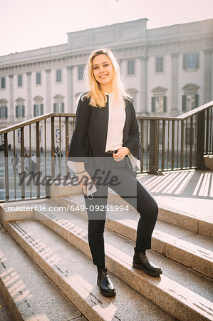 Young woman with long blond hair, full length portrait, Milan, Italy