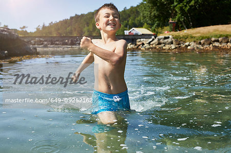 Boy marching in lake