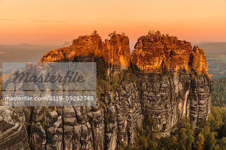 Schrammstein rocks at sunrise in Elbe Sandstone Mountains, Germany, Europe