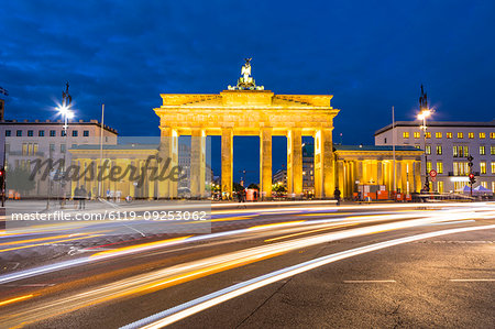 Light trails by Brandenburg Gate at night in Berlin, Germany, Europe