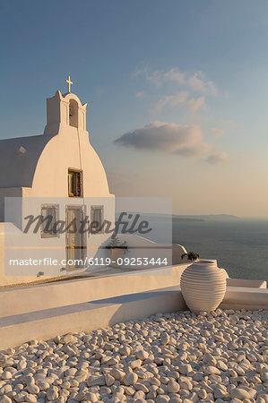View of traditional white washed church at sunset in Oia, Santorini, Cyclades, Aegean Islands, Greek Islands, Greece, Europe