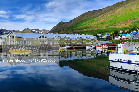 Harbour, hotel and fishing boats, mountains, reflections, Siglufjordur, (Siglufjorour), stunning Summer weather, North Iceland, Europe