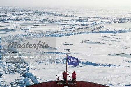 People enjoying the breaking ice on board of an icebreaker, North Pole, Arctic People enjoying the breaking ice on board of an icebreaker, North Pole, Arctic