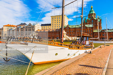 Boats docked at the harbour in Helsinki with Uspenski cathedral in the background, Uusimaa, Finland, Scandinavia, Europe