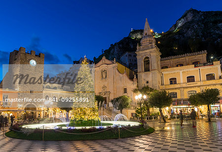 San Guiseppe church and the clock tower gate at Piazza IX Aprile during blue hour, Taormina, Sicily, Italy, Europe