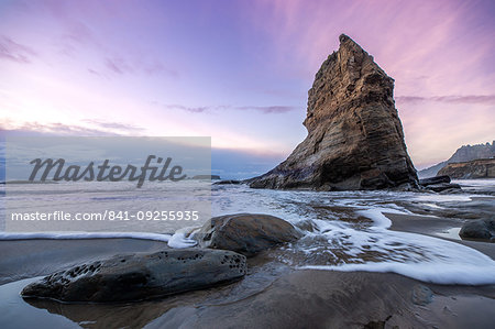 A Sea stack with a subtle sunset on the ocean, Newport, Oregon, United States of America