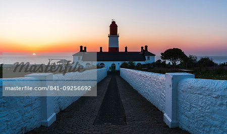 Sunrise behind Souter Lighthouse, Marsden, South Shields, Tyne and Wear, England, United Kingdom, Europe