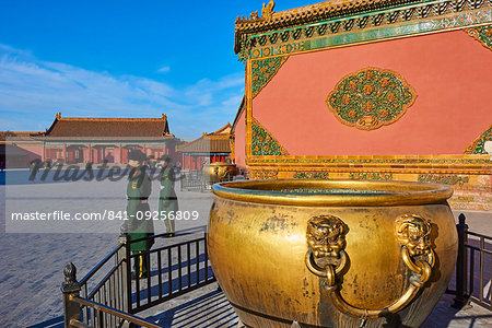 Golden cistern and security guards in the Forbidden City, Beijing, China