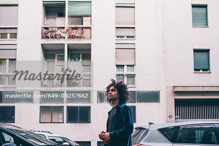 Young man exploring city, Milano, Lombardia, Italy