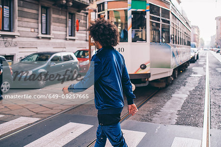 Young man exploring city, Milano, Lombardia, Italy