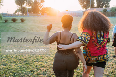 Friends walking in park