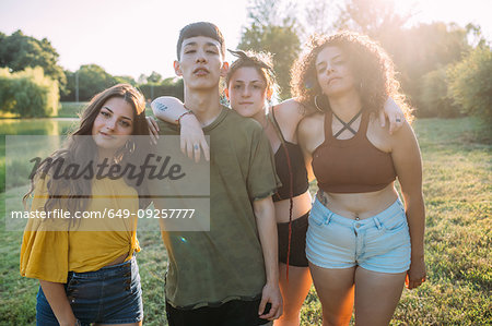 Friends posing by lake