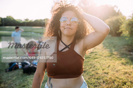 Young woman and friends by lake