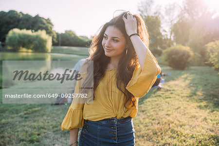 Young woman by lake